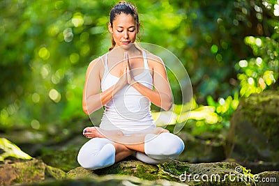 Beautiful Woman Practicing Yoga Outside In Nature