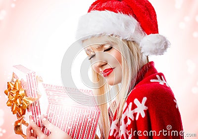 Beautiful woman in red hat with opened gift box