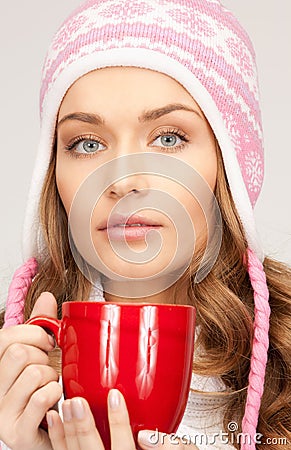 Beautiful woman with red mug