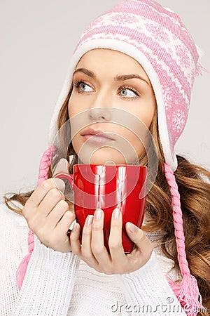 Beautiful woman with red mug