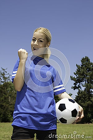 Beautiful woman with soccer ball