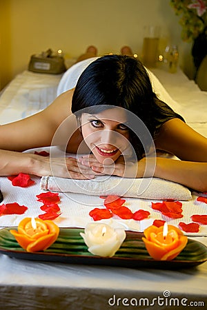 Beautiful woman in spa relaxing waiting for massage