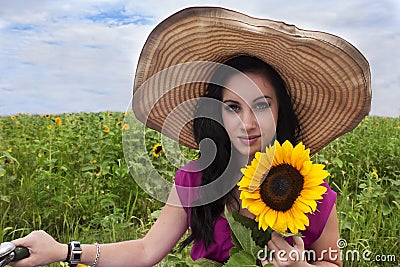 Beautiful woman with sunflower