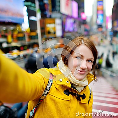 http://thumbs.dreamstime.com/x/beautiful-woman-taking-selfie-times-square-young-her-smartphone-new-york-53590478.jpg