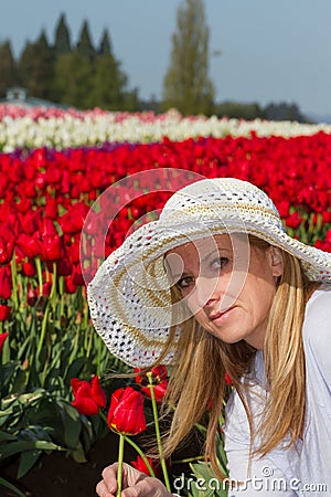 Beautiful woman in the tulip field