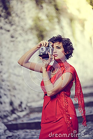 Beautiful woman in urban background. Vintage style