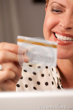 Beautiful Woman Using Laptop Holding Credit Card