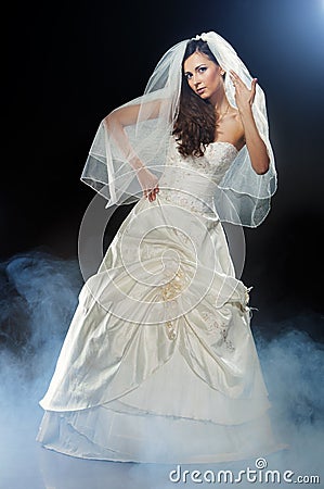 Beautiful woman wearing luxurious wedding dress