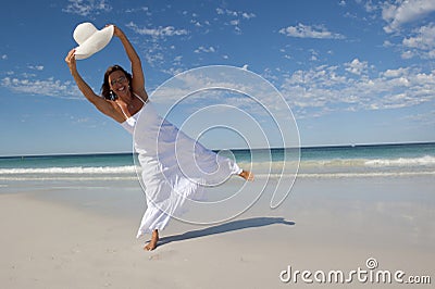 Beautiful Woman in White Dress at Beach