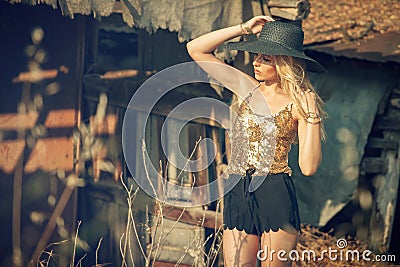 Beautiful young blond woman with sun hat.