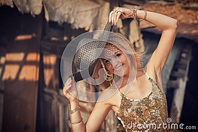 Beautiful young blond woman with sun hat.