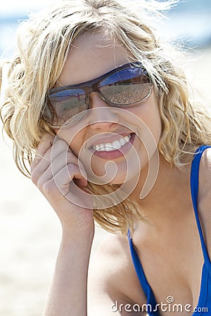 Beautiful Young Blond Woman in Sunglasses Smiling