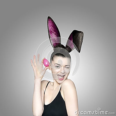 Beautiful young brunette woman as easter bunny