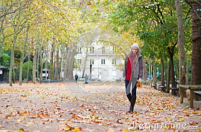 Beautiful young girl walking on a fall day