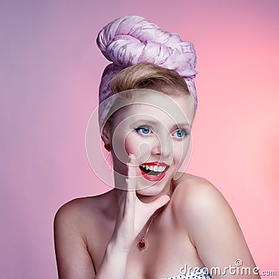 Beautiful young sexy pin-up girl with surprised expression, on white background