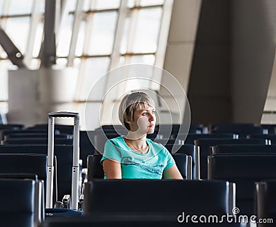 Beautiful young woman at the airport