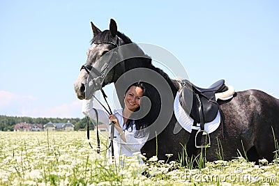 Beautiful young woman and gray horse portrait