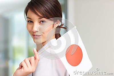 http://thumbs.dreamstime.com/x/beautiful-young-woman-holding-japanese-flag-11556126.jpg
