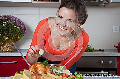Beautiful young woman in modern kitchen