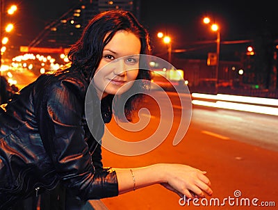 Beautiful young woman in night city