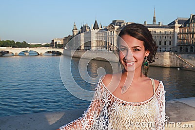 Beautiful young woman on a Paris Bridge