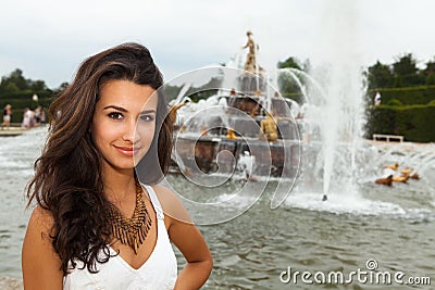 http://thumbs.dreamstime.com/x/beautiful-young-woman-paris-enjoying-fountains-35094905.jpg