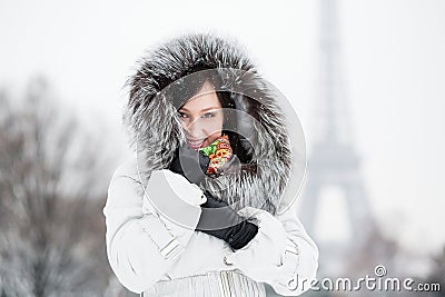 Beautiful young woman in Paris on a winter day