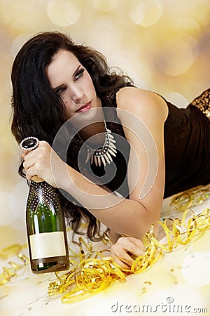 Beautiful young woman partying with champagne