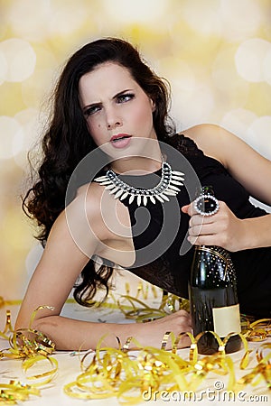 Beautiful young woman partying with champagne