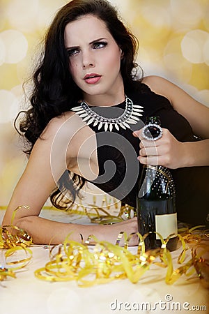 Beautiful young woman partying with champagne