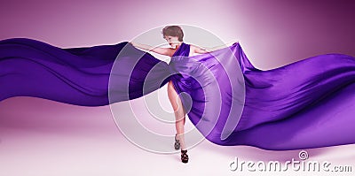 Beautiful young woman in purple dress