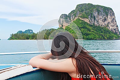 A beautiful young woman relaxing on speed boat