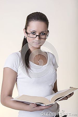 Beautiful Young Woman Standing With Book Open