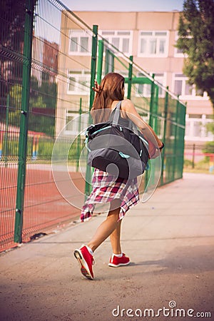 http://thumbs.dreamstime.com/x/beautiful-young-woman-walking-sports-ground-girl-playing-basketball-outdoors-43113742.jpg