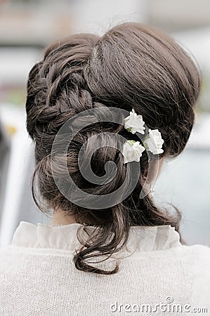 Beauty wedding hairstyle with flowers