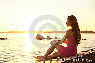 Beauty woman on the beach at sunset. Enjoy nature. Luxury girl r