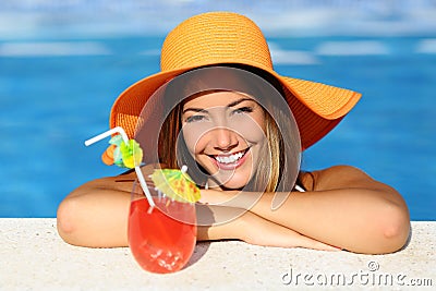 Beauty woman with perfect smile enjoying in a swimming pool on vacations