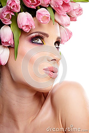 Beauty woman portrait with wreath from flowers on head over whit