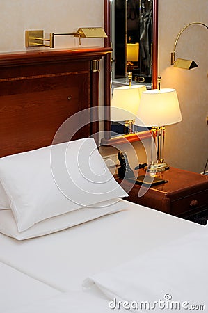 Bed and night table in a hotel room