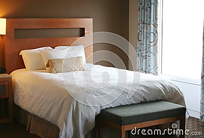 Bedroom with white blanket on bed