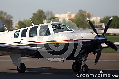 Beechcraft A36 Bonanza business aircraft running on the runway