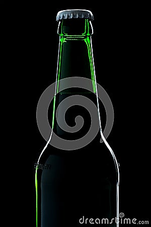 Beer bottle close-up over black