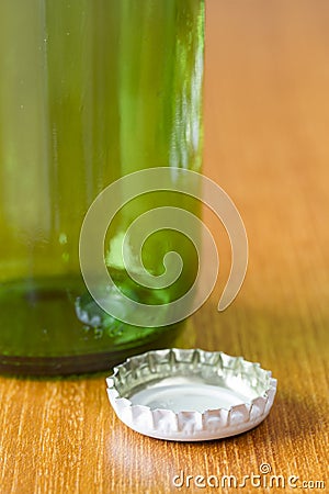 Beer bottle with a white cap