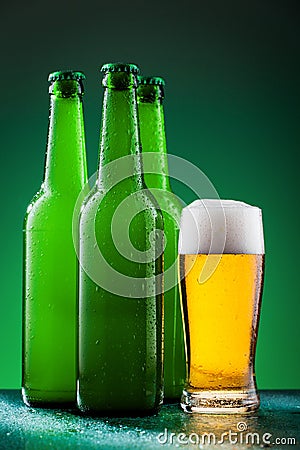 Beer bottles with full glass