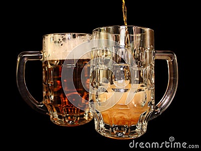 Beer is poured into a mug
