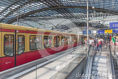 BERLIN, GERMANY - JULY 25: Unknown commuters are traveling by train at the central station of Berlin on July 25, 2013 in the centr