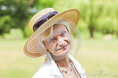 Best ager women outoors with hat