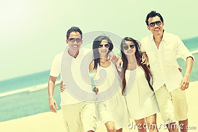 Best friend in white having fun laughing together at the beach