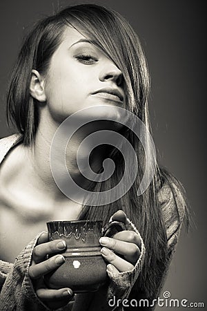 Beverage. Girl holding cup mug of hot drink tea or coffee