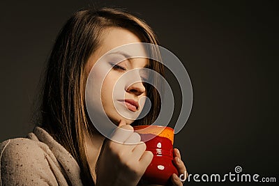 Beverage. Girl holding cup mug of hot drink tea or coffee